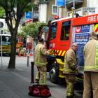 Firefighters at the scene of the laundry fire in Stratton House, Queenstown this afternoon. Photo: Josh Walton