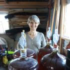 Elisabeth Nicholson displays some of the apple cider made from apples picked from her Mosgiel and...