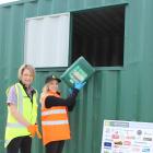 Placing a container into the recycling station at Farmlands Taieri is Agrecovery operations...