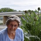 Peg Mathieson and her artichoke plant. Photo: Shawn McAvinue