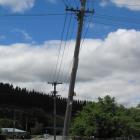 A power pole stands at an angle in Clyde on the corner of Sunderland and Whitby Sts, beside the...