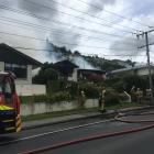 Firefighters battle a blaze in Oamaru this afternoon. Photo: Hamish MacLean