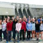 Taking a tour of the Clyde Dam are New Delhi students (front, from left, red top) Allen Alex (17)...