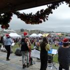 A band (left) plays festive tunes at Christmas at the Harbour in Oamaru yesterday. Photos: Daniel...