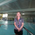 Health and fitness aquatics supervisor Christina Hayward stands in front of the ceiling, where...