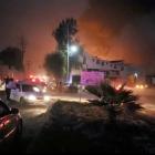 People react at the scene where a ruptured fuel pipeline exploded, in the municipality of...