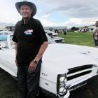 Norman Fisher, of Twizel, shows off his 1966 Pontiac Parisienne convertible  at the Cromwell...