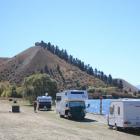 Camping vehicles parked on the shore of Lake Dunstan at Lowburn. Photo: ODT files
