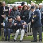 Gordon Weare shakes the hand of RSA member Fred Daniels with former squadron aircrew member...
