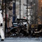 A forensic officer is seen at the scene of a suspected car bomb in Londonderry. Photo: Reuters