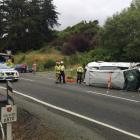 A people mover ended up on its side after a crash near Waitati this afternoon. Photo: Gregor...