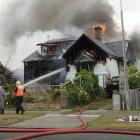 Crews battle the blaze in Invercargill this afternoon. Photo: Corrina Jane Photography 