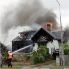 The Gordon St house on fire on Tuesday. Photo: Corrina Jane Photography