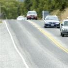 Holiday traffic on State Highway 8 at Millers Flat, heads towards Central Otago. Photo by Peter...