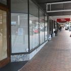 The Madam Woo restaurant in Dunedin, with its windows papered over and its closing notice. The...