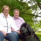 Clutha District Council chief executive Steve Hill, wife Lana and pet Newfoundland Maddie relax...