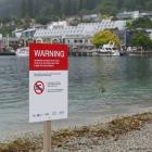 Signs installed by the Queenstown Lakes District Council yesterday at Queenstown Bay urge people...