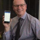 University of Otago information services director Mike Harte uses the new Otago App, helping...
