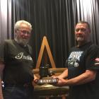 John Munro (left) presents the prestigious Spirit of Burt Munro award to Alexandra motorbike...
