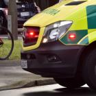 Ambulance and police at an accident between a vehicle and cyclist on corner of Hanover St and...