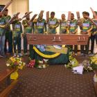 Members of the Green Island Super Chunkz cricket team form a final guard of honour on Saturday at...