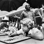 Students Frank Gwynne (left) and Donald Ellis pick at baked beans with toothpicks for an...