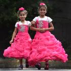 Former Syrian refugees Narjes (8) and Ayat (10) Jamal dressed up for a welcoming ceremony for new...