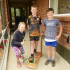 Meg Howard shows off her boot cleaner with Ben Cairns (centre) and Alfie Cowie (all 10). Photos:...