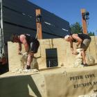 Former All Blacks Andrew Hore (left) and Ian Kirkpatrick go head to head during a speed shearing...