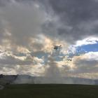 A helicopter with a monsoon bucket is being used to fight the blaze. Photo: George Block