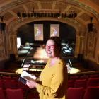 iD Dunedin Fashion Week spokeswoman Nicola McConnell flicks through an event programme at the...