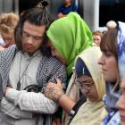 Supporters mourn outside the Al Huda mosque yesterday. PHOTOS: STEPHEN JAQUIERY
