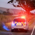 Police work at the scene of a fatal car accident near Palmerston yesterday. Photo: Stephen Jaquiery