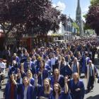 Otago Polytechnic graduands march up George St before their graduation ceremony last year. PHOTO:...