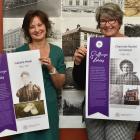 Heritage NZ assessment advisers Susan Irvine (left) and Sarah Gallagher show posters telling the...