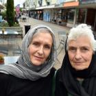 Alison Gilmore (left) and Caroline Maze wear headscarves in Christchurch yesterday afternoon, to...