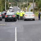 Police have flooded a Sommerville St. Photo: Tim Miller
