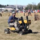 Local man Tom McCone takes part in a lawn mower race at the Strath Taieri A&amp;P Show at...