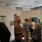 Members of the Wanaka community get their first glance at the Wai Water Wanaka exhibition. PHOTO:...