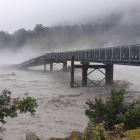 Much of the West Coast is cut off after a section of the Waiho River bridge was swept away. Photo...