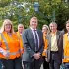 Wearing their orange vests are (from left) Waste Management Ltd compliance co-ordinator Trudy...