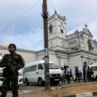 Sri Lankan military officials stand guard in front of the St. Anthony's Shrine, Kochchikade...