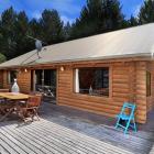 An American couple are selling their alpine-style log house on Corsican Drive. Photo: Supplied