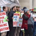 About 30 striking junior doctors and supporters protested outside Health Minister David Clark's office at midday. Photo: Peter McIntosh