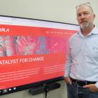 Xerra Earth Observation Institute Ltd chief executive Steve Cotter stands beside the rebranded...