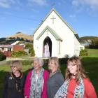 Standing in front of the 120-year-old  Mary Queen of Peace Church in Broad Bay  are (from left)...