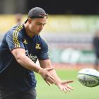 Highlanders lock Tom Franklin passes the ball during a training session at Forsyth Barr Stadium...