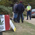 Police and council staff issue a trespass notice to the organisers of the Harvest Festival near...