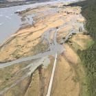 The Dart River flooding Kinloch's only access road in heavy rain. Photo: Mountain Scene