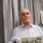 Retired bank manager Norman Mills, of Invercargill, browses through the Dunedin Savings Bank...